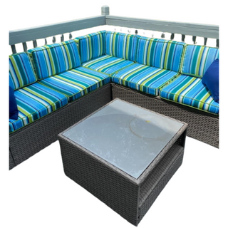 Outdoor couch set with blue, green, and white striped fabric