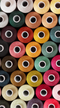 Rolls of colorful Threads sewing threads