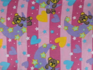 Stars, Moon and Hearts Polar Fleece Fabric in Pink