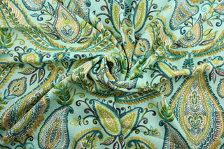 The Robert Allen© Ombre Paisley in Pool is a multi-purpose fabric that will lend a modern elegance to any home.  Featuring a large and colorful paisley design and made of 100% slubby basket fabric, it combines aqua, teal, green, white, gray, and tan for a stunning look.  It can be used for several different statement projects including window accents (drapery, curtains and swags), toss pillows, headboards, bed skirts, duvet covers, upholstery, and more.