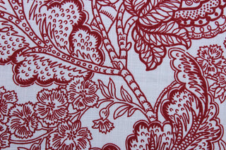 The Robert Allen© Avillez in Red/Blue is the perfect multipurpose fabric choice for any space. The large red floral pattern stands out against the light blue background, making it both eye-catching and stylish.  Its 100,000 double rubs and soil and stain resistance make it a practical and durable choice.  It can be used for several different statement projects including window accents (drapery, curtains and swags), toss pillows, bedding, pillows, and upholstery.