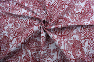 The Robert Allen© Avillez in Red/Blue is the perfect multipurpose fabric choice for any space. The large red floral pattern stands out against the light blue background, making it both eye-catching and stylish.  Its 100,000 double rubs and soil and stain resistance make it a practical and durable choice.  It can be used for several different statement projects including window accents (drapery, curtains and swags), toss pillows, bedding, pillows, and upholstery.