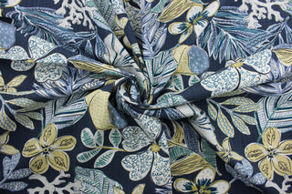 This multi-purpose fabric showcases elements of floral, tropical, and nautical themes in striking shades of blue, green, white, and neutral. The perfect choice for adding a sophisticated twist to any décor. This fabric is also designed for durability, boasting 65,000 double rubs and a soil and stain repellant finish.  It can be used for several different statement projects including window accents (drapery, curtains and swags), toss pillows, headboards, bed skirts, duvet covers, upholstery, and more.
