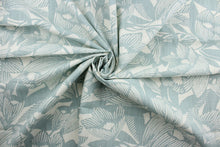 Load image into Gallery viewer, The Robert Allen© Romaria Park in Aquatint fabric is an excellent choice for a variety of projects. It features a stylish floral print in light aqua and off white hues. This multi-purpose fabric is also designed for durability, boasting 65,000 double rubs and a soil and stain repellant finish.  It can be used for several different statement projects including window accents (drapery, curtains and swags), toss pillows, headboards, bed skirts, duvet covers, upholstery, and more.
