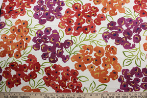 The Robert Allen© Luxury Floral in Poppy is a multi-purpose fabric with a bright and colorful large floral print.  Featuring orange, red, green, and purple colors, this fabric is set on a crisp white background, making it perfect for any space.  It can be used for several different statement projects including window accents (drapery, curtains and swags), toss pillows, headboards, bed skirts, duvet covers and upholstery. 