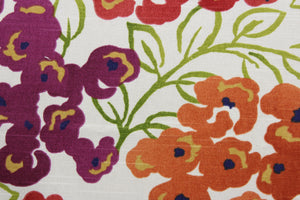 The Robert Allen© Luxury Floral in Poppy is a multi-purpose fabric with a bright and colorful large floral print.  Featuring orange, red, green, and purple colors, this fabric is set on a crisp white background, making it perfect for any space.  It can be used for several different statement projects including window accents (drapery, curtains and swags), toss pillows, headboards, bed skirts, duvet covers and upholstery. 