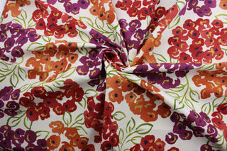 The Robert Allen© Luxury Floral in Poppy is a multi-purpose fabric with a bright and colorful large floral print.  Featuring orange, red, green, and purple colors, this fabric is set on a crisp white background, making it perfect for any space.  It can be used for several different statement projects including window accents (drapery, curtains and swags), toss pillows, headboards, bed skirts, duvet covers and upholstery. 