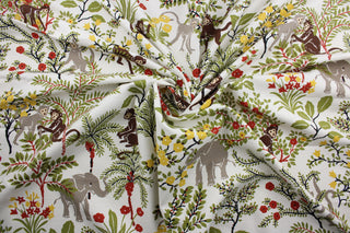 This Robert Allen© Niklas fabric showcases a fun print of monkeys, elephants, trees, and flowers. The vibrant colors of rust, terra cotta, green, yellow, grey, and brown pop against the white background. The fabric is finished with a soil and stain repellant that makes it easy to maintain. It can be used for several different statement projects including window accents (drapery, curtains and swags), toss pillows, headboards, bed skirts, duvet covers and upholstery. 