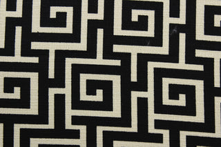 The Robert Allen© Square Maze in Ink adds a contemporary yet timeless touch to any space.  Boasting a stylish geometric print in a light beige and black, this fabric is designed with 15,000 double rubs and features a soil and stain repellant finish.  It can be used for several different statement projects including window accents (drapery, curtains and swags), toss pillows, headboards, bed skirts, duvet covers, upholstery, and more.