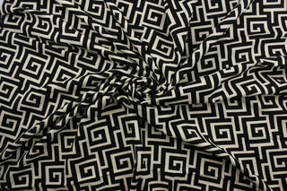 The Robert Allen© Square Maze in Ink adds a contemporary yet timeless touch to any space.  Boasting a stylish geometric print in a light beige and black, this fabric is designed with 15,000 double rubs and features a soil and stain repellant finish.  It can be used for several different statement projects including window accents (drapery, curtains and swags), toss pillows, headboards, bed skirts, duvet covers, upholstery, and more.