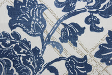 Load image into Gallery viewer, The Robert Allen© Bluebonnet in Indigo features a unique, multipurpose print with geometric and floral motifs that come together in a distinctive indigo blue, gold, and white color palette. It&#39;s designed to withstand up to 100,000 double rubs, and is dirt and stain repellant for worry-free use. It can be used for several different statement projects including window accents (drapery, curtains and swags), toss pillows, headboards, bed skirts, duvet covers, upholstery, and more.
