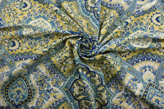 This multi-purpose fabric features a vibrant floral damask print with a subtle mix of yellow, blue, and white colors. Crafted with a soil and stain repellent finish, it's perfect for anything from drapery to upholstery.  It can be used for several different statement projects including window accents (drapery, curtains and swags), toss pillows, headboards, bed skirts, duvet covers, upholstery, and more.