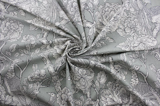  The Robert Allen© Tweedbank in Grey is perfect for any space - its multipurpose design makes it highly versatile.  This printed fabric features flowering branches and peacocks in shades of grey and white.  Plus, its soil and stain repellant finish makes it easy to maintain.  It can be used for several different statement projects including window accents (drapery, curtains and swags), toss pillows, headboards, bed skirts, duvet covers, upholstery, and more.