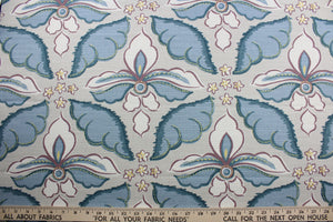  a large floral print with soft colors of plum, blue, white and yellow, this multipurpose fabric features a light taupe background for lasting appeal. Certified with 30,000 double rubs and treated with a soil and stain repellant finish, this fabric is perfect for bringing your interior design ideas to life.  It can be used for several different statement projects including window accents (drapery, curtains and swags), toss pillows, headboards, bed skirts, duvet covers, upholstery, and more.