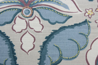  a large floral print with soft colors of plum, blue, white and yellow, this multipurpose fabric features a light taupe background for lasting appeal. Certified with 30,000 double rubs and treated with a soil and stain repellant finish, this fabric is perfect for bringing your interior design ideas to life.  It can be used for several different statement projects including window accents (drapery, curtains and swags), toss pillows, headboards, bed skirts, duvet covers, upholstery, and more.