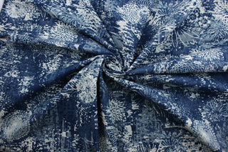 The Robert Allen© Fezara in Indigo is a multi-purpose fabric made with a unique bold floral collage print in indigo and white. It's strong and durable, with a 100,000 double rubs rating. Plus, it's treated with a soil and stain repellent finish, making it perfect for heavy use. It can be used for several different statement projects including window accents (drapery, curtains and swags), toss pillows, headboards, bed skirts, duvet covers, upholstery, and more.