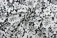Load image into Gallery viewer,  The Robert Allen© Floral Silhouette in Black offers a timeless yet modern design featuring a large flower print in classic black and white.  Made for multi-purpose use, the fabric is also treated with a soil and stain repellant finish.  It can be used for several different statement projects including window accents (drapery, curtains and swags), toss pillows, headboards, bed skirts, duvet covers and upholstery. 
