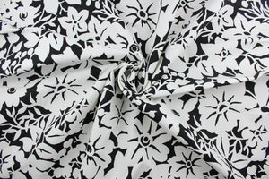  The Robert Allen© Floral Silhouette in Black offers a timeless yet modern design featuring a large flower print in classic black and white.  Made for multi-purpose use, the fabric is also treated with a soil and stain repellant finish.  It can be used for several different statement projects including window accents (drapery, curtains and swags), toss pillows, headboards, bed skirts, duvet covers and upholstery. 