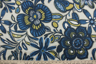 The large-scale floral print features shades of black, gray, gold, indigo, and cream on a natural background. The durable fabric has a 30,000 double rub rating and is soil and stain resistant, making it a practical and fashionable choice.  It can be used for several different statement projects including window accents (drapery, curtains and swags), toss pillows, headboards, bed skirts, duvet covers, upholstery, and more.