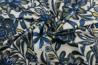 The large-scale floral print features shades of black, gray, gold, indigo, and cream on a natural background. The durable fabric has a 30,000 double rub rating and is soil and stain resistant, making it a practical and fashionable choice.  It can be used for several different statement projects including window accents (drapery, curtains and swags), toss pillows, headboards, bed skirts, duvet covers, upholstery, and more.