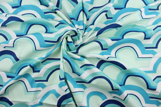 The Robert Allen© Eden Roo in Aqua is crafted with a geometric print, highlighted with beautiful colors including aqua, light mint green, white, and navy blue. Practical and stylish, it also has a soil and stain repellant finish to keep it looking vibrant.  It can be used for several different statement projects including window accents (drapery, curtains and swags), toss pillows, headboards, bed skirts, duvet covers and upholstery. 