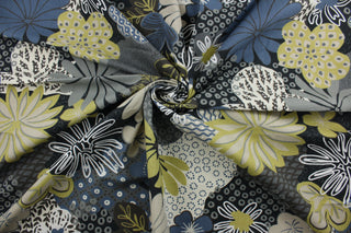 Robert Allen© Zomper in Twilight is a beautiful large floral print fabric featuring gold, blue, brown, grey, white, black, and khaki.  The soil and stain repellent finish make it suitable for any environment, and its durability rating of 100,000 double rubs ensures it will withstand the test of time.  It can be used for several different statement projects including window accents (drapery, curtains and swags), toss pillows, headboards, bed skirts, duvet covers and upholstery. 