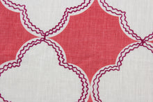 Load image into Gallery viewer,  This Robert Allen© Simza in Peony fabric is perfect for an array of multipurpose projects. The linen material is adorned with a quatrefoil pattern in peony and white, accented with striking dark magenta embroidery for a subtle but stunning effect.  Uses include drapery, pillows, light upholstery, table runners, bedding, headboards, apparel, and home décor.
