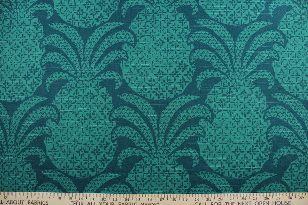 The Robert Allen© Colony Club in Marrakech Green features a large, multipurpose pineapple print on a dark blue green background.  It's made of durable fabric, boasting 30,000 double rubs that resists wear and tear.  It can be used for several different statement projects including window accents (drapery, curtains and swags), toss pillows, headboards, bed skirts, duvet covers and upholstery. 