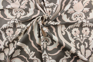  The Robert Allen© Kathryn in Putty fabric is perfect for multipurpose projects. Constructed of a cotton blend, this damask print fabric features a pink, off white, and putty color palette.  It can be used for several different statement projects including window accents (drapery, curtains and swags), toss pillows, headboards, bed skirts, duvet covers, upholstery, and more.