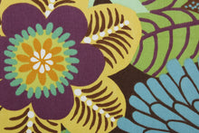 Load image into Gallery viewer, This multipurpose fabric features a large floral print and an array of bright and subtle colors including green, yellow, orange, blue, purple, and white, all set against a warm brown background.  Crafted with soil and stain repellant, this luxe fabric is sure to enliven any room.  It can be used for several different statement projects including window accents (drapery, curtains and swags), toss pillows, headboards, bed skirts, duvet covers and upholstery. 
