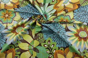 This multipurpose fabric features a large floral print and an array of bright and subtle colors including green, yellow, orange, blue, purple, and white, all set against a warm brown background.  Crafted with soil and stain repellant, this luxe fabric is sure to enliven any room.  It can be used for several different statement projects including window accents (drapery, curtains and swags), toss pillows, headboards, bed skirts, duvet covers and upholstery. 