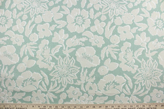 The Robert Allen© Thea Damask in Indigo, a multipurpose fabric, features a large floral print in aloe, beige, and white. Constructed for durability, it is rated for 100,000 double rubs and is soil and stain resistant.  It can be used for several different statement projects including window accents (drapery, curtains and swags), toss pillows, headboards, bed skirts, duvet covers, upholstery, and more.