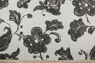 It features a bold floral vine pattern printed on a lightweight cotton duck, complete with a beautiful natural slub texture on a light cream background. This fabric is built to last with a durability rating of 65,000 double rubs for a lasting finish.  It can be used for several different statement projects including window accents (drapery, curtains and swags), toss pillows, headboards, bed skirts, duvet covers and upholstery. 