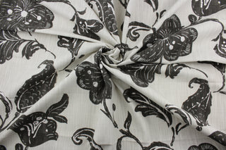 It features a bold floral vine pattern printed on a lightweight cotton duck, complete with a beautiful natural slub texture on a light cream background. This fabric is built to last with a durability rating of 65,000 double rubs for a lasting finish.  It can be used for several different statement projects including window accents (drapery, curtains and swags), toss pillows, headboards, bed skirts, duvet covers and upholstery. 