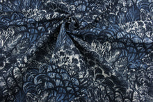 Load image into Gallery viewer, Robert Allen© Wimbu Land in Indigo is perfect for any space. This multi-purpose fabric has a beautiful floral print in deep indigo and crisp white.  Plus, it&#39;s also stain and water resistant with a heavy-duty 30,000 double rub rating. It can be used for several different statement projects including window accents (drapery, curtains and swags), toss pillows, headboards, bed skirts, duvet covers, upholstery, and more.
