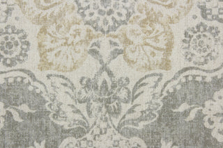 features an intricate damask floral design printed on a cotton duck base for a multipurpose use.  The unique design has an aged and distressed look, with golden tan and natural tones on a gray background.  The versatile fabric is perfect for window accents (draperies, valances, curtains and swags) cornice boards, accent pillows, bedding, headboards, cushions, ottomans, slipcovers and upholstery. 