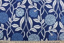 Load image into Gallery viewer, Boasting a blue, gray, and white pattern, this fabric is sure to bring a multifaceted look to any interior. The fabric is also designed for long-lasting performance, with an impressive 15,000 double rubs and soil and stain resistant finish. It can be used for several different statement projects including window accents (drapery, curtains and swags), toss pillows, headboards, bed skirts, duvet covers and upholstery. 
