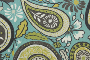 Robert Allen© Art Paisley in Rain is a stunning multipurpose fabric with a striking floral paisley petal print. Its vibrant, yet neutral palette of brown, white, citrine, green, and turquoise make it perfect for a variety of projects.  Plus, this fabric is soil and stain resistant.  It can be used for several different statement projects including window accents (drapery, curtains and swags), toss pillows, headboards, bed skirts, duvet covers and upholstery. 