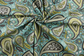 Robert Allen© Art Paisley in Rain is a stunning multipurpose fabric with a striking floral paisley petal print. Its vibrant, yet neutral palette of brown, white, citrine, green, and turquoise make it perfect for a variety of projects.  Plus, this fabric is soil and stain resistant.  It can be used for several different statement projects including window accents (drapery, curtains and swags), toss pillows, headboards, bed skirts, duvet covers and upholstery. 