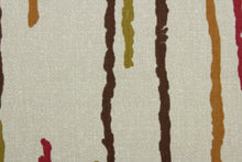 Load image into Gallery viewer, The Robert Allen© Abstract Lines in Henna fabric is a multipurpose, abstract print on a light tan background. The colors are henna, brown, olive, and bronze for a unique, eye-catching look. With a soil and stain resistant finish, this fabric is highly durable, with a rating of 100,000 double rubs. It can be used for several different statement projects including window accents (drapery, curtains and swags), toss pillows, headboards, bed skirts, duvet covers and upholstery. 
