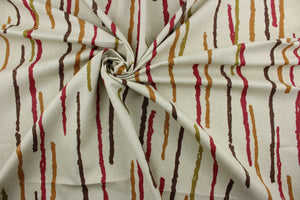 The Robert Allen© Abstract Lines in Henna fabric is a multipurpose, abstract print on a light tan background. The colors are henna, brown, olive, and bronze for a unique, eye-catching look. With a soil and stain resistant finish, this fabric is highly durable, with a rating of 100,000 double rubs. It can be used for several different statement projects including window accents (drapery, curtains and swags), toss pillows, headboards, bed skirts, duvet covers and upholstery. 