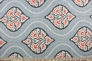 Robert Allen© Kavali in Persimmon fabric is a multi-purpose fabric with a geometric print in persimmon, charcoal, and white against a light slate blue background.  It features excellent durability with a 65,000 double rub rating.  It can be used for several different statement projects including window accents (drapery, curtains and swags), toss pillows, headboards, bed skirts, duvet covers and upholstery. 