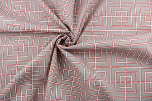 Robert Allen© Frestscene in Coral is a high performance, multipurpose outdoor fabric. Featuring a stylish geometrical print, this fabric is perfect for any outdoor space, like porches, patios, or poolside. The coral, taupe, and ivory color palette adds warmth and style. Its 100,000 double rubs, water and stain repellant, mildew resistant, and superior light fastness make it a reliable and durable choice for all your outdoor needs. Use for pillows, cushions, upholstery, umbrellas, tote bags, and more.
