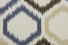 Load image into Gallery viewer, This Robert Allen© Ikat Trellis in Mineral is perfect for any space. The multipurpose fabric features a geometrical ikat print in a mineral colorway of brown, blue, and tan. It is durable with 30,000 double rubs and soil and stain resistant. It can be used for several different statement projects including window accents (drapery, curtains and swags), toss pillows, headboards, bed skirts, duvet covers and upholstery. 
