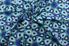 Load image into Gallery viewer, The Robert Allen© Starscope in Turquoise is a multipurpose fabric with a beautiful geometric print in shades of turquoise, navy blue, and white.  It is also soil and stain resistant, making it perfect for any home.  It can be used for several different statement projects including window accents (drapery, curtains and swags), toss pillows, headboards, bed skirts, duvet covers and upholstery. 
