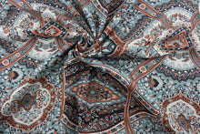 Load image into Gallery viewer, This multi-purpose fabric features a floral damask print with a mix of aqua, white, coral, and black colors. Crafted with a soil and stain repellent finish, it&#39;s perfect for anything from drapery to upholstery.  It can be used for several different statement projects including window accents (drapery, curtains and swags), toss pillows, headboards, bed skirts, duvet covers, upholstery, and more.
