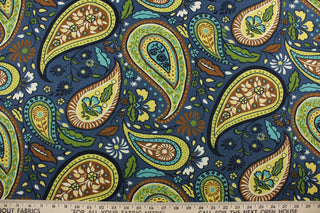 Robert Allen© Art Paisley in Indigo is a stunning multipurpose fabric with a striking floral paisley petal print. Its vibrant colors of sky blue, green, yellow, brown, ivory, and indigo make it perfect for a variety of projects.  Plus, this fabric is soil and stain resistant.  It can be used for several different statement projects including window accents (drapery, curtains and swags), toss pillows, headboards, bed skirts, duvet covers and upholstery. 