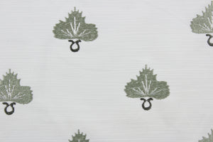 Effortlessly elevate any space with the versatile and elegant Embroidered August in Pearl Greyhound. The finely embroidered sage green medallion with pearl grey accents, against a white background adds a touch of sophistication to drapery, pillows, light upholstery, table runners, bedding, headboards, home décor, and even apparel. Perfect for any style or purpose.