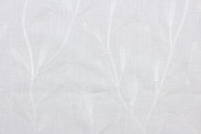 Load image into Gallery viewer, The Embroidered Tangle in Ivory features a stunning vine leaf design that adds an elegant touch to any space. Its multi-purpose use makes it a versatile choice for drapery, pillows, light upholstery, table runners, bedding, headboards, home décor, and even apparel. 
