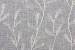 The Embroidered Tangle in Grey Pewter features a stunning vine leaf design in champagne set against a grey pewter background.  The elegant design adds an elegant touch to any space. Its multi-purpose use makes it a versatile choice for drapery, pillows, light upholstery, table runners, bedding, headboards, home décor, and even apparel. 